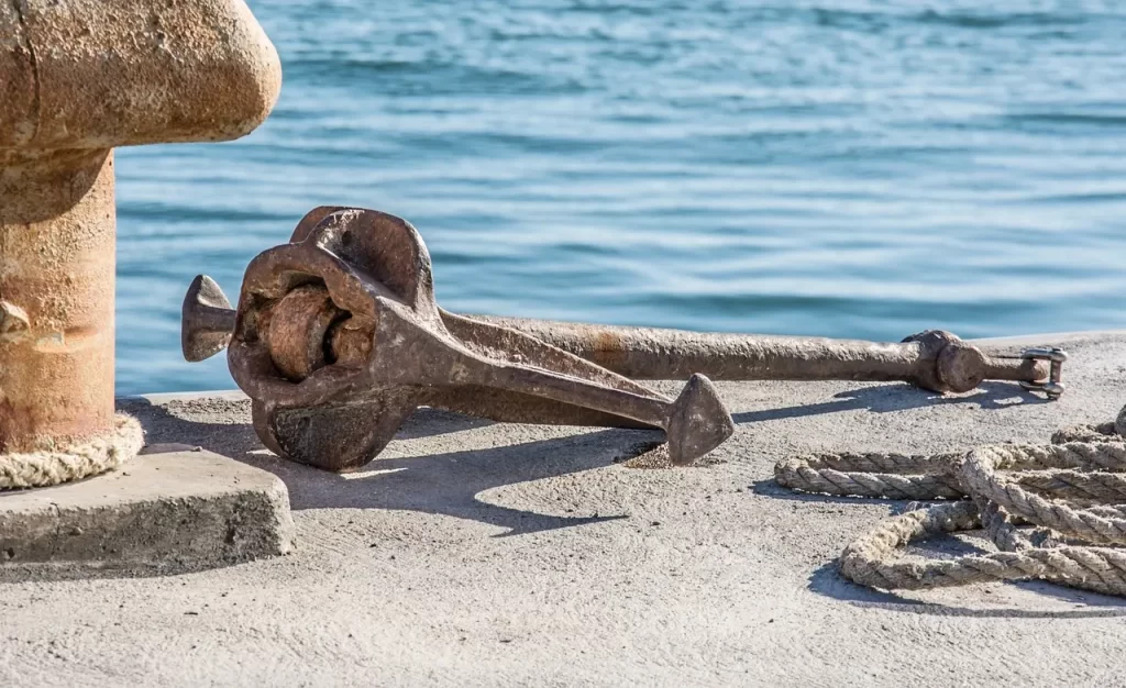 Rusty dockside anchor symbolizing nautical heritage in DockSwag™’s Harbour Line aesthetic